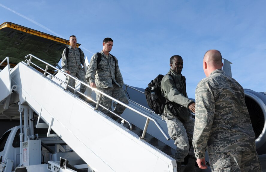 Col. Jeffrey Neischel, 5th Bomb Wing vice commander, greets 5th Bomb Wing team members as they return from the Air Force Global Strike Challenge  on Minot Air Force Base, N.D., Nov. 6, 2014. The teams received their scores the previous day at Barksdale Air Force Base, La. (U.S. Air Force photo/Senior Airman Stephanie Morris)