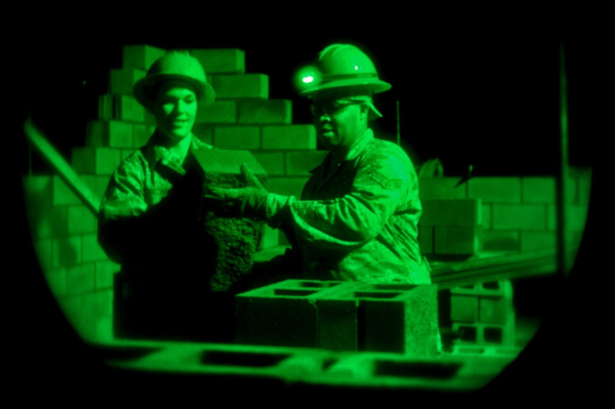 Staff Sgt. Deborah Silverthorne and Senior Airman Travis Mainor, both with the 567th RED HORSE out of Seymour Johnson Air Force Base, North Carolina, work on a concrete masonry unit block, more commonly known as a cinder block, project during a field training exercise at Fort Smith, Arkansas, Nov. 5, 2014. The weeklong exercise, also featuring the 560th RED HORSE out of Joint Base Charleston, South Carolina, and Airmen out of the 4th Fighter Wing at Seymour Johnson AFB, is hosting 174 participants to provide upgrade training and prepare for an upcoming operation in support of Beyond the Horizon. Beyond the Horizon, conducted annually, is part of U.S. Army South and U.S. Southern Command’s humanitarian and civic assistance program, which works closely with host-nation forces and civilian organizations to provide medical, dental, and engineering support. (U.S. Air Force photo/Airman 1st Class Brittain Crolley)