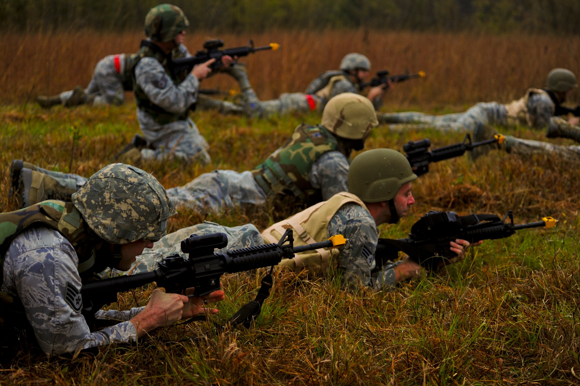 Airmen assigned to the 567th RED HORSE out of Seymour Johnson Air Force Base, North Carolina, practice defensive fighting positions during a field training exercise at Fort Smith, Arkansas, Nov. 5, 2014. The weeklong exercise, also featuring the 560th RED HORSE out of Joint Base Charleston, South Carolina, and Airmen out of the 4th Fighter Wing at Seymour Johnson AFB, is hosting 174 participants to provide upgrade training and prepare for an upcoming operation in support of Beyond the Horizon. Beyond the Horizon, conducted annually, is part of U.S. Army South and U.S. Southern Command’s humanitarian and civic assistance program, which works closely with host-nation forces and civilian organizations to provide medical, dental, and engineering support. (U.S. Air Force photo/Airman 1st Class Brittain Crolley)