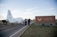 Members of the aircraft maintenance section, help move a T-38 Talon Nov. 1 out of the Vance Air Force Base, Oklahoma west gate and transport it to the main gate to be displayed as a static. The T-38 came to Vance from Warner Robins, AFB, Georgia.  Members from the Enid community donated funds to bring the plane to the base airpark. (U.S. Air Force photo/Staff Sgt. Nancy Falcon)