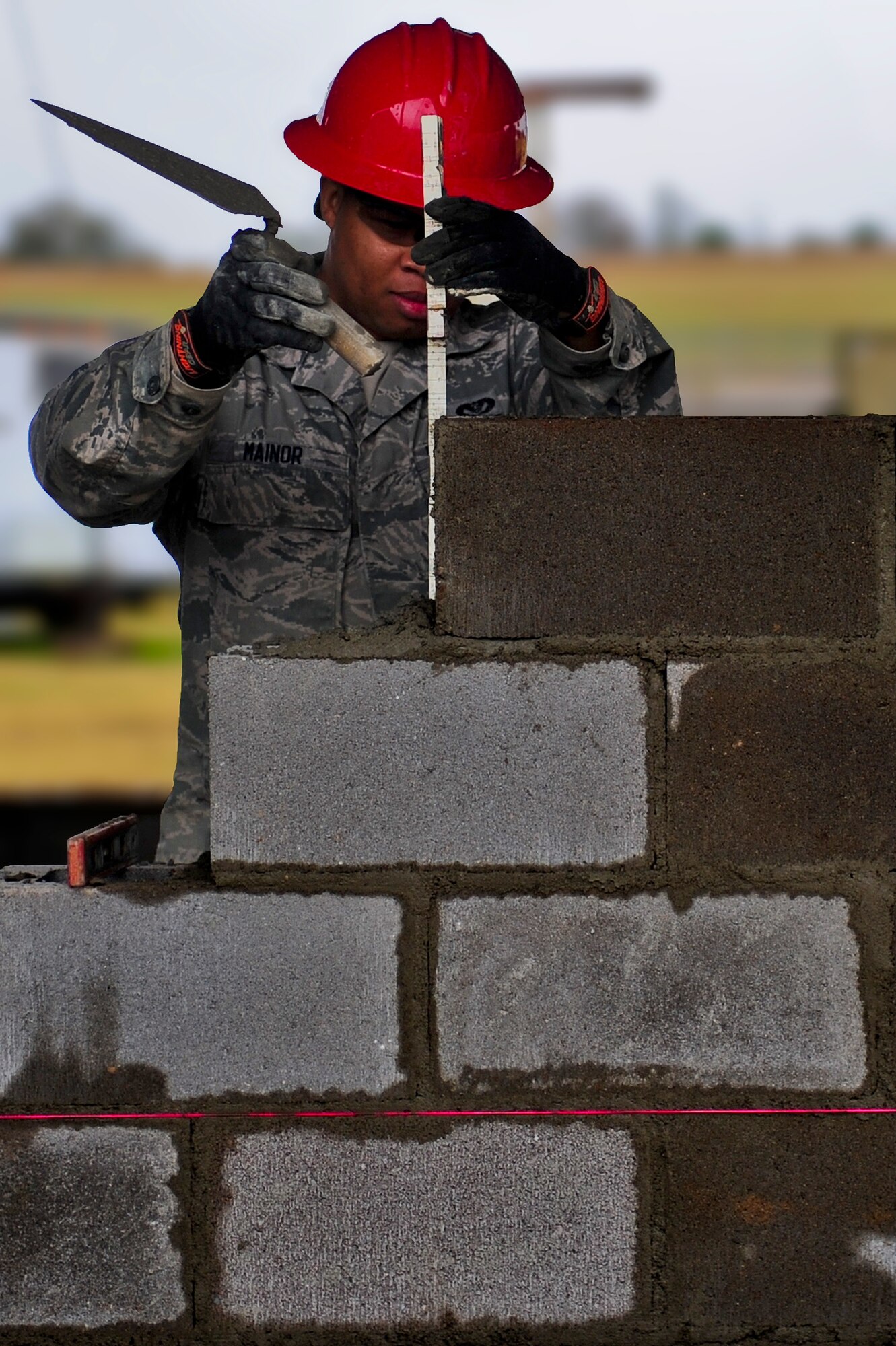 Senior Airman Travis Mainor, with the 567th RED HORSE out of Seymour Johnson Air Force Base, North Carolina, works on a concrete masonry unit block, more commonly known as cinder block, project during a field training exercise at Fort Smith, Arkansas, Nov. 4, 2014. The weeklong exercise, also featuring the 560th RED HORSE out of Joint Base Charleston, South Carolina, and Airmen out of the 4th Fighter Wing at Seymour Johnson AFB, is hosting 174 participants to provide upgrade training and prepare for an upcoming operation in support of Beyond the Horizon. Beyond the Horizon, conducted annually, is part of U.S. Army South and U.S. Southern Command’s humanitarian and civic assistance program, which works closely with host-nation forces and civilian organizations to provide medical, dental, and engineering support. (U.S. Air Force photo/Airman 1st Class Brittain Crolley)