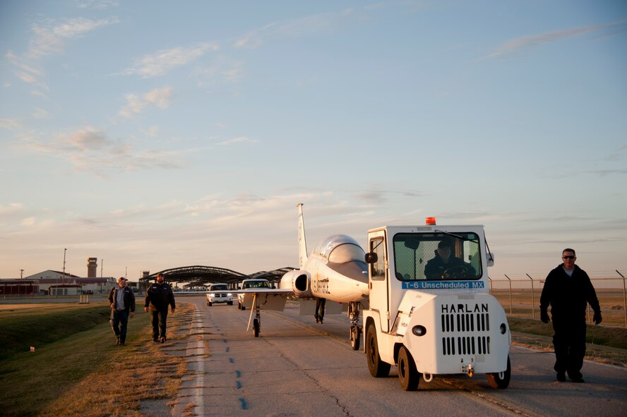 Members from the aircraft maintenance section, place a T-38 Talon at the base airpark near the main gate entrance Nov. 1 to be displayed as a static at Vance Air Force Base, Oklahoma. This T-38 came to Vance from Warner Robins, AFB, Georgia. Members from the Enid community donated funds to bring the plane to Vance.  (U.S. Air Force photo/Staff Sgt. Nancy Falcon)