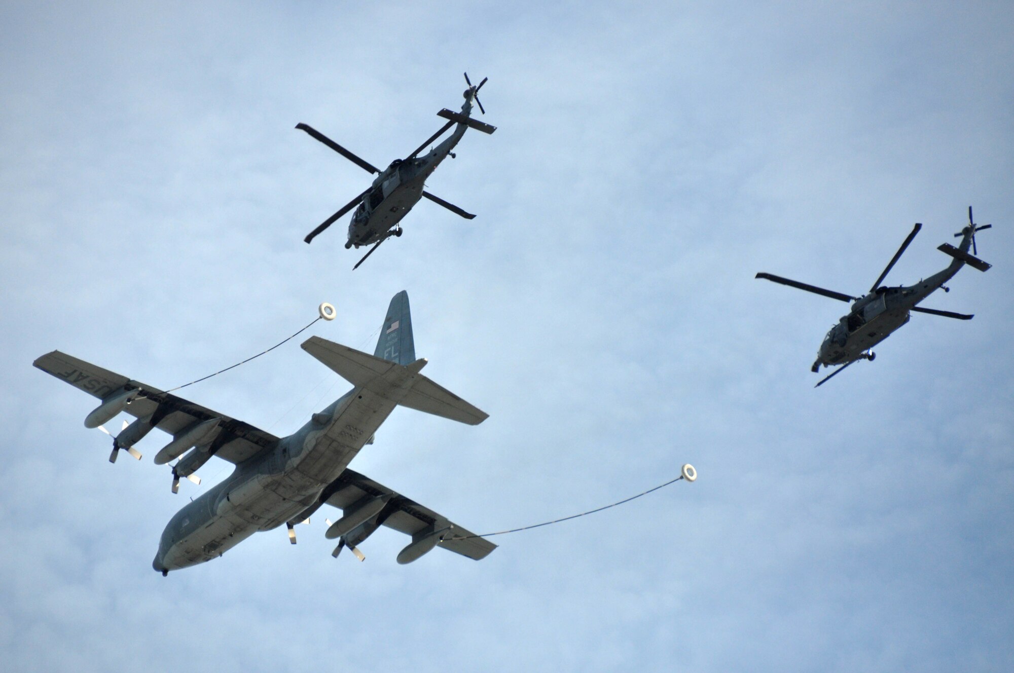 A KC-130 King performers a simulated refueling training mission during a congressional staffer visit to Patrick AFB, Nov 7. The KC-130 is the primary air-to-air refueling platform for the HH-60 Pavehawk helicopters assigned to the 920th Rescue Wing.  (U.S. Air Force Photo/Capt. Joe Simms)