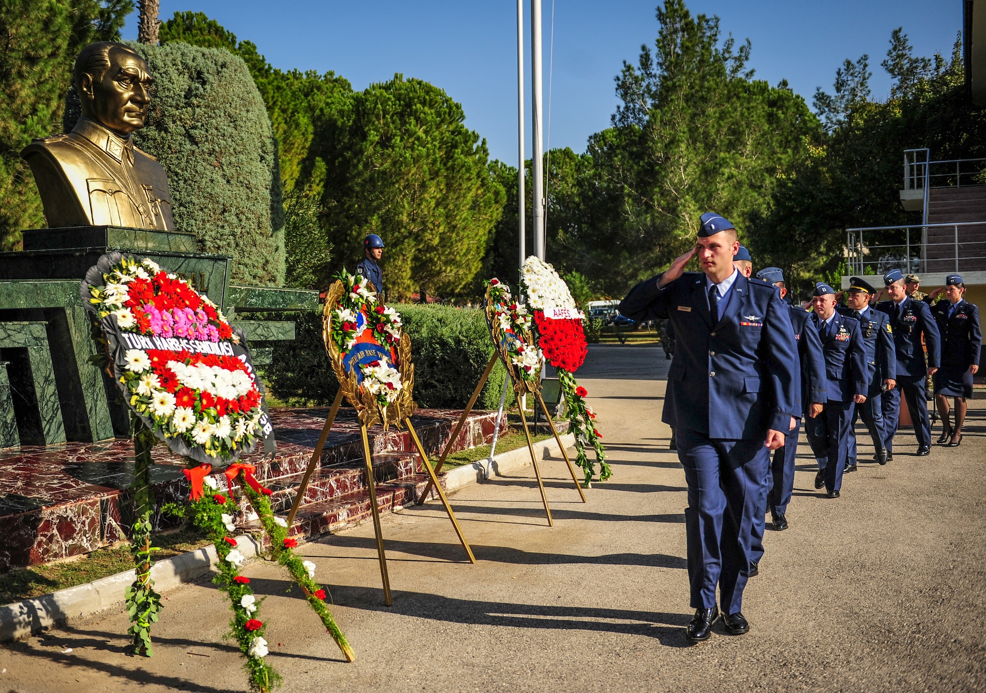 1st Lt. Joshua Brunson, 39th Communications Squadron Cyber Transport Systems officer in charge, salutes a monument of Mustafa Kemal Ataturk during the Ataturk Memorial Day ceremony Nov. 10, 2014, Incirlik Air Base, Turkey. Ataturk devoted his life to domestic and international peace. He advocated equal rights for women, social justice and recognition of human dignity for all people. (U.S. Air Force photo by Airman Cory W. Bush/Released)