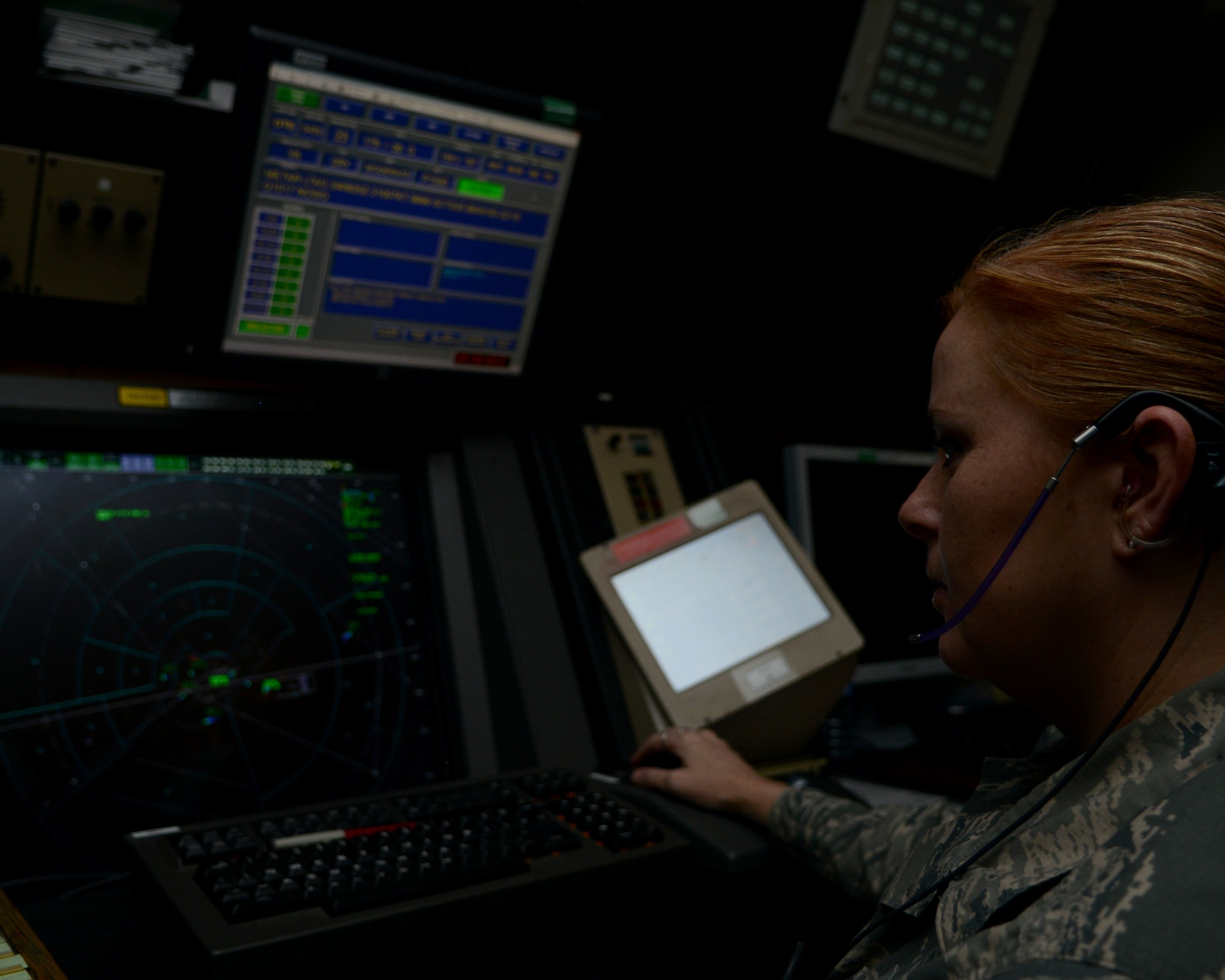 Tech. Sgt. Crista Parker, 39th Operations Support Squadron radar approach control watch supervisor, views a radar screen Oct. 24, 2014, Incirlik Air Base, Turkey. The radar approach control flight is responsible for bringing in all U.S. aircraft  as well as departures. (U.S. Air Force photo by Staff Sgt. Caleb Pierce/Released)