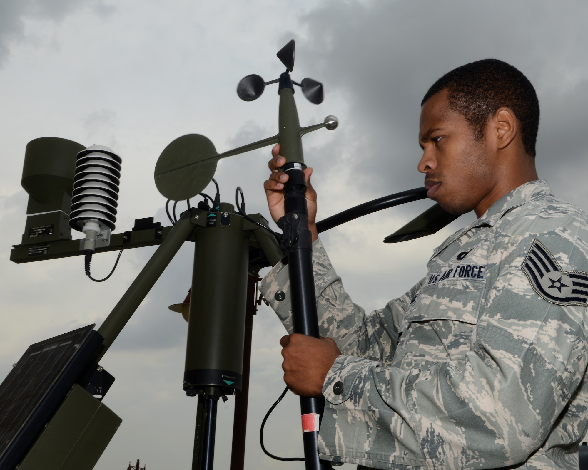 Staff Sgt. Tyreese Clark, 39th Operations Support Squadron operation support weather flight noncommissioned officer in-charge of mission integration function, assembles a weather stand Oct. 24, 2014, Incirlik Air Base, Turkey. The weather flight provides up-to-date weather information that is important for safe flight operations. (U.S. Air Force photo by Staff Sgt. Caleb Pierce/Released)   