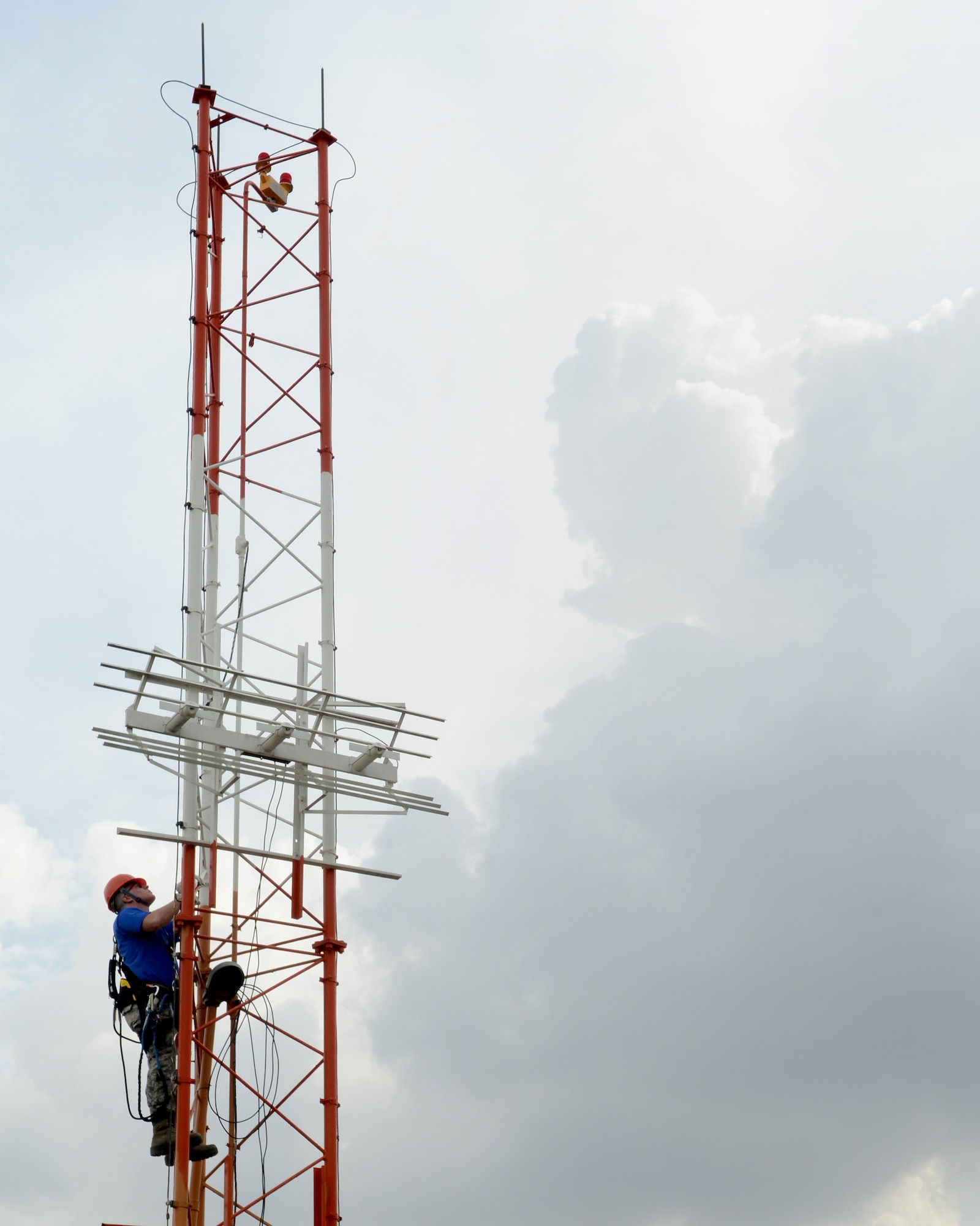 Airman 1st Class Matthew Coyle, 39th Operations Support Squadron airfield systems apprentice, climbs a glide slope tower Oct. 24, 2014, Incirlik Air Base, Turkey. The glide scope tower is maintained by the 39th OSS and is used to radiate a signal and gives a glide path angle to landing aircraft. (U.S. Air Force photo by Staff Sgt. Caleb Pierce/Released) 