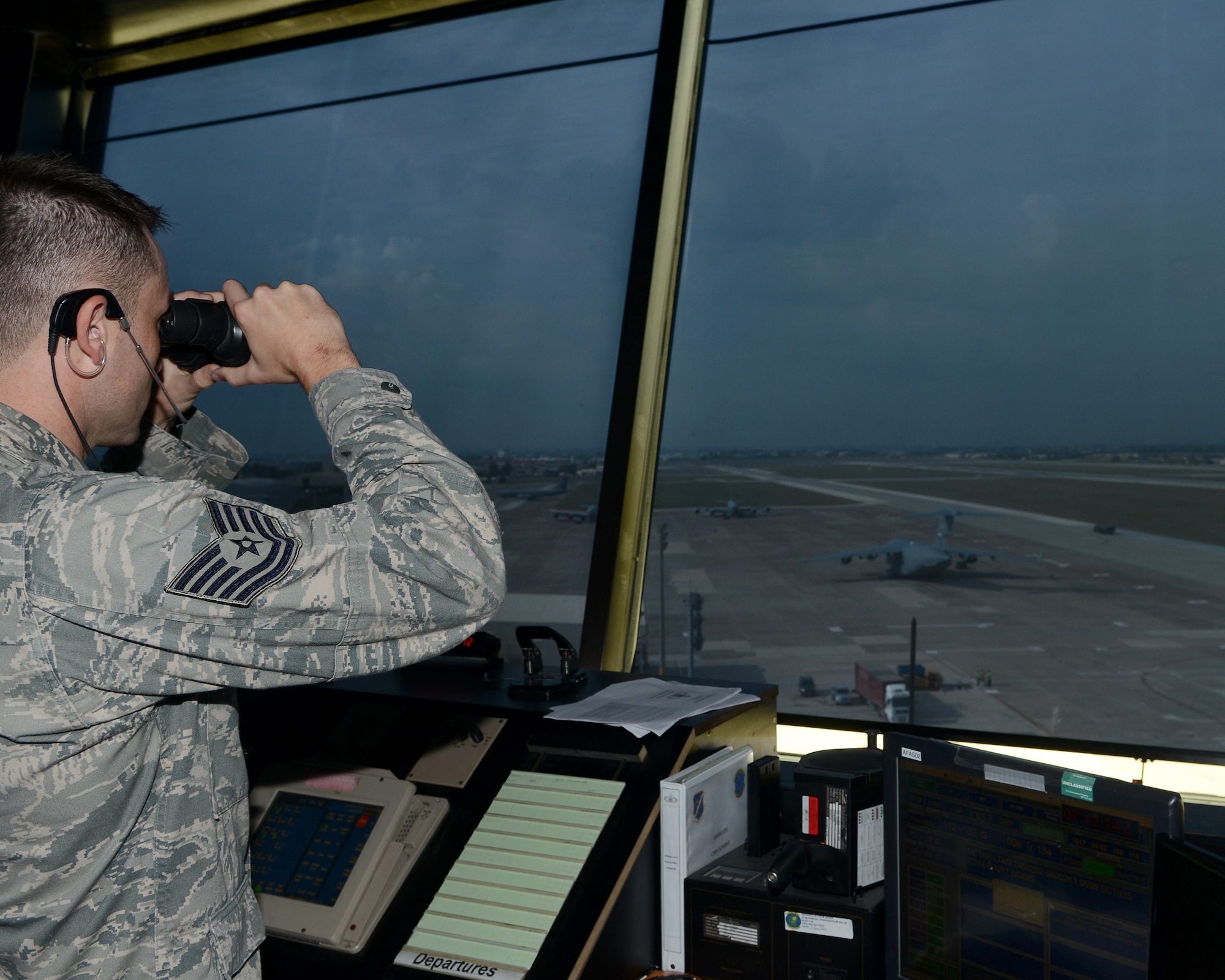 Tech. Sgt. Blaine Caudill, 39th Operations Support Squadron air traffic control tower watch supervisor, views the runway for aircraft Oct. 24, 2014, Incirlik Air Base, Turkey. The air traffic control tower is responsible for the safety of all incoming and departing aircraft. (U.S. Air Force photo by Staff Sgt. Caleb Pierce/Released)