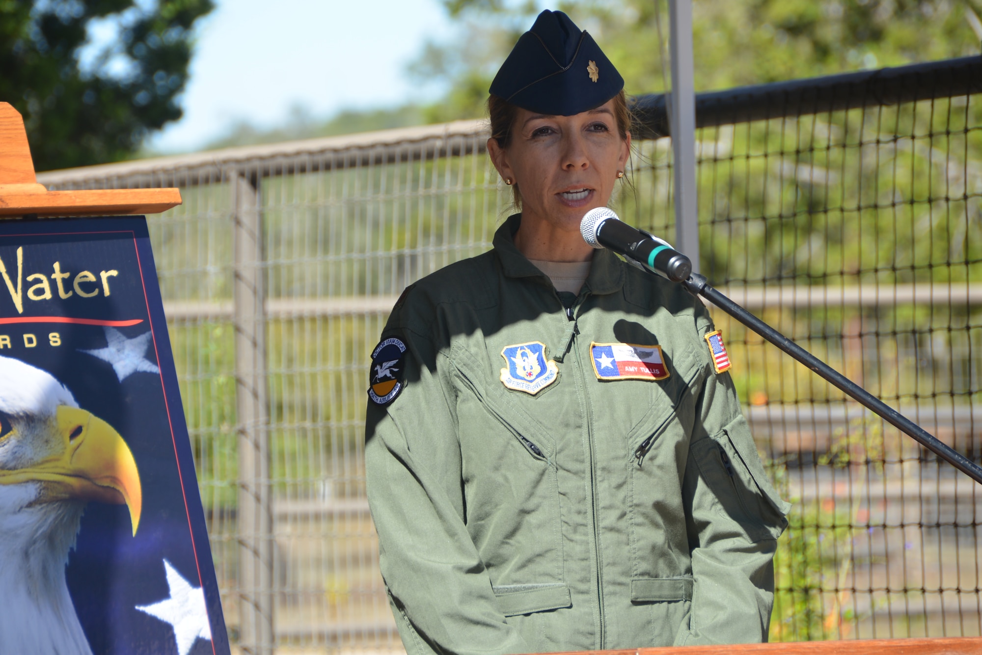 Air Force Major Amy Tullis, 433rd Airlift Wing, pilot, speaks at a Veterans’ Freedom Day luncheon, Nov. 8, 2014 at the Singing Waters Vineyards in Comfort, Texas. Tullis, who flies the C-5A Galaxy, is an instructor pilot at the 433rd Airlift Wing, Joint Base San Antonio-Lackland, Texas. She is also a pilot for Delta Airlines. She went on to talk about her role as an Air Force Reserve pilot and the mission of the strategic aircraft that she flies, which delivers palletized, oversized cargo and combat ready troops anywhere in the world. Tullis has flown missions around the world including in support of OPERATIONS ENDURING and IRAQI FREEDOM, accumulating over 700 combat hours. 