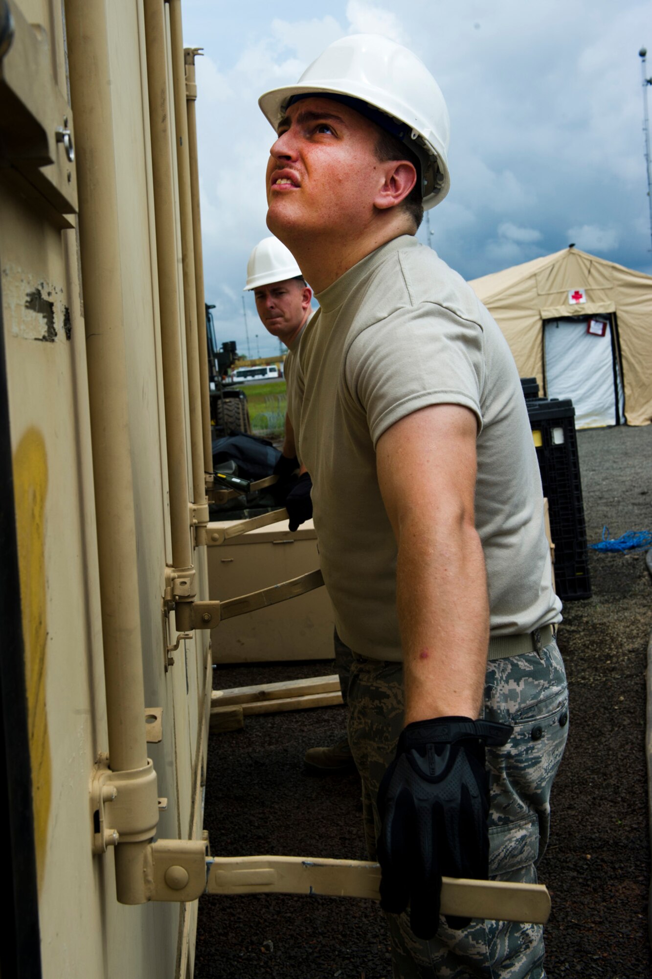 U.S. Air Force Staff Sgt. Zachary Huston from the Joint Task Force-Port Opening assigned to the 621st Contingency Response Wing stationed at Joint Base McGuire-Dix-Lakehurst, N.J., prepares equipment for re-deployment after completing their mission at Roberts International Airport, Republic of Liberia, during Operation UNITED ASSISTANCE, Nov. 9, 2014. The JTF-PO established a hub for cargo distribution to help alleviate the increased traffic of airflow and cargo during OUA, a Department of Defense operation in Liberia to provide logistics, training and engineering support to U.S. Agency for International Development-led efforts to contain the Ebola virus outbreak in western Africa. (U.S. Air Force photo/Staff Sgt. Gustavo Gonzalez/RELEASED)