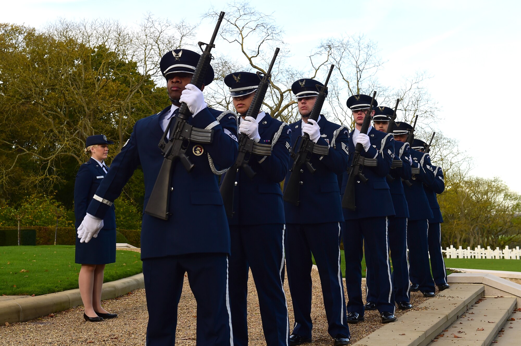 Members of the 423rd Air Base Group Honor Guard perform a volley during a Veterans Day ceremony at Cambridge American Cemetery, United Kingdom, Nov. 11, 2014. The Honor Guard joined other Service members from the 501st Combat Support Wing in recognizing veterans both past and present. (U.S. Air Force photo by Tech. Sgt. Chrissy Best/Released)