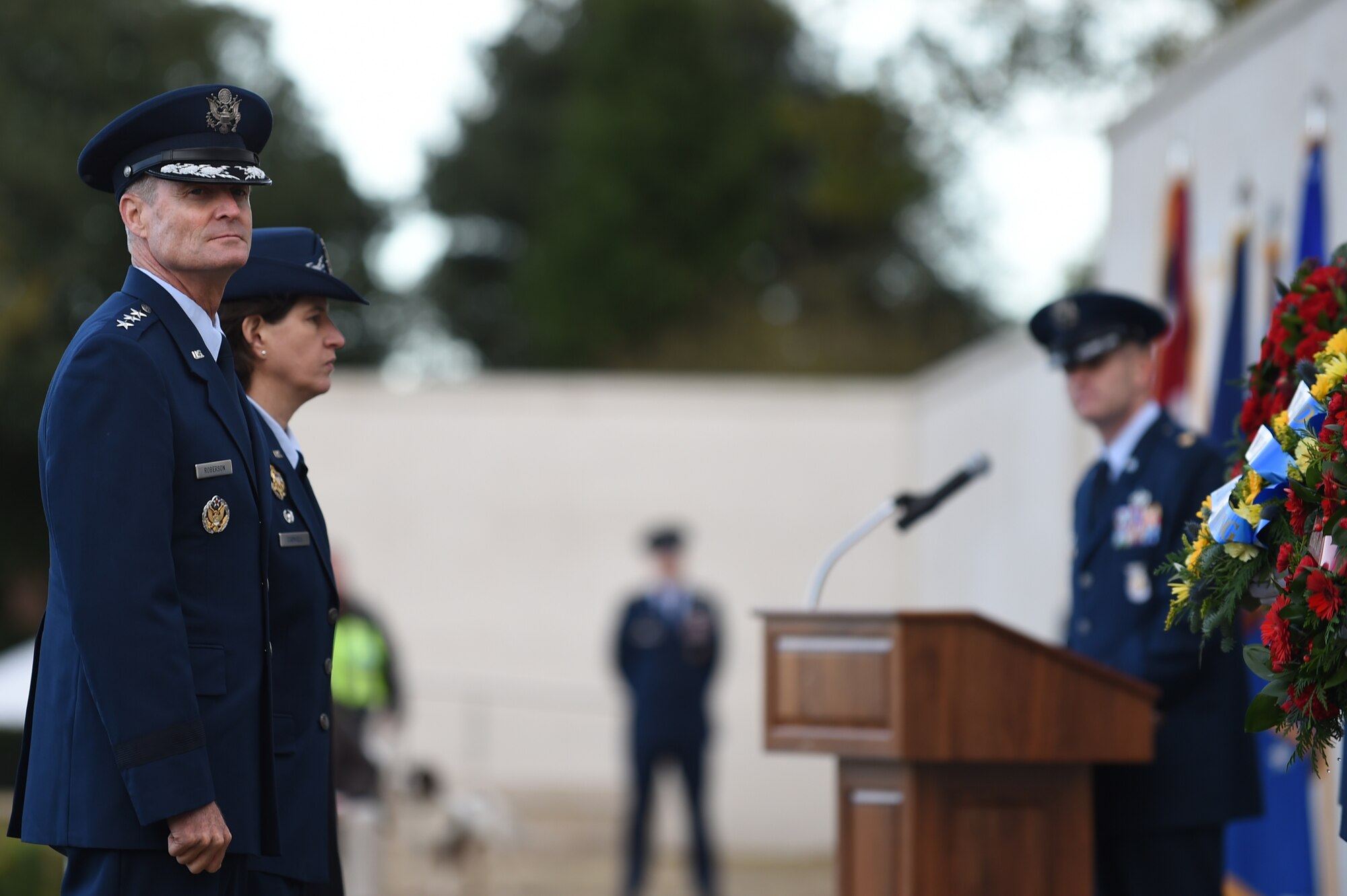 U.S. Air Force Lt. Gen. Darryl Roberson, 3rd Air Force commander, and Col. Angela Cadwell, 501st Combat Support Wing commander, pause before laying wreaths during a Veterans Day ceremony at Cambridge American Cemetery, United Kingdom, Nov. 11, 2014. Both American and British Service members joined with local leaders to pay their respects to the fallen heroes buried at the cemetery. (U.S. Air Force photo by Staff Sgt. Jarad A. Denton/Released)