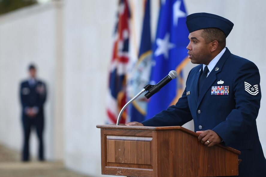 U.S. Air Force Tech. Sgt. Forrest Booker, 423rd Civil Engineer Squadron operations superintendent, recited the poem, “In Flanders Fields,” during a Veterans Day Ceremony at Cambridge American Cemetery, United Kingdom, Nov. 11, 2014. The poem, authored by Canadian military doctor and artillery commander, Maj. John McCrae, is widely recognized as the inspiration behind wearing poppies in remembrance of Service members. (U.S. Air Force photo by Staff Sgt. Jarad A. Denton/Released)