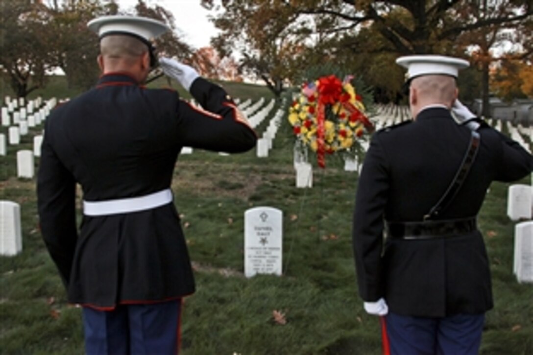 Marine Corps Col. James Iulo and Sgt. Maj. Irvin Howard lay a wreath to honor Sgt. Maj. Dan Daly, two-time Medal of Honor recipient, in Brooklyn, N.Y., Nov. 10, 2014. Daly was one of two Marines in history to receive the nation’s highest honor twice. Iulo is the commanding officer for the 1st Marine Corps District and Howard is the district's sergeant major. 