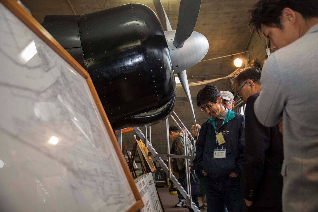 Japanese aviators tour the Zero Hangar aboard Marine Corps Air Station Iwakuni, Japan, during a flight security conference, Nov 1. 2014. The conference allowed for a unique gathering of Japanese civilians and U.S. military members for the common benefit of aviation safety.