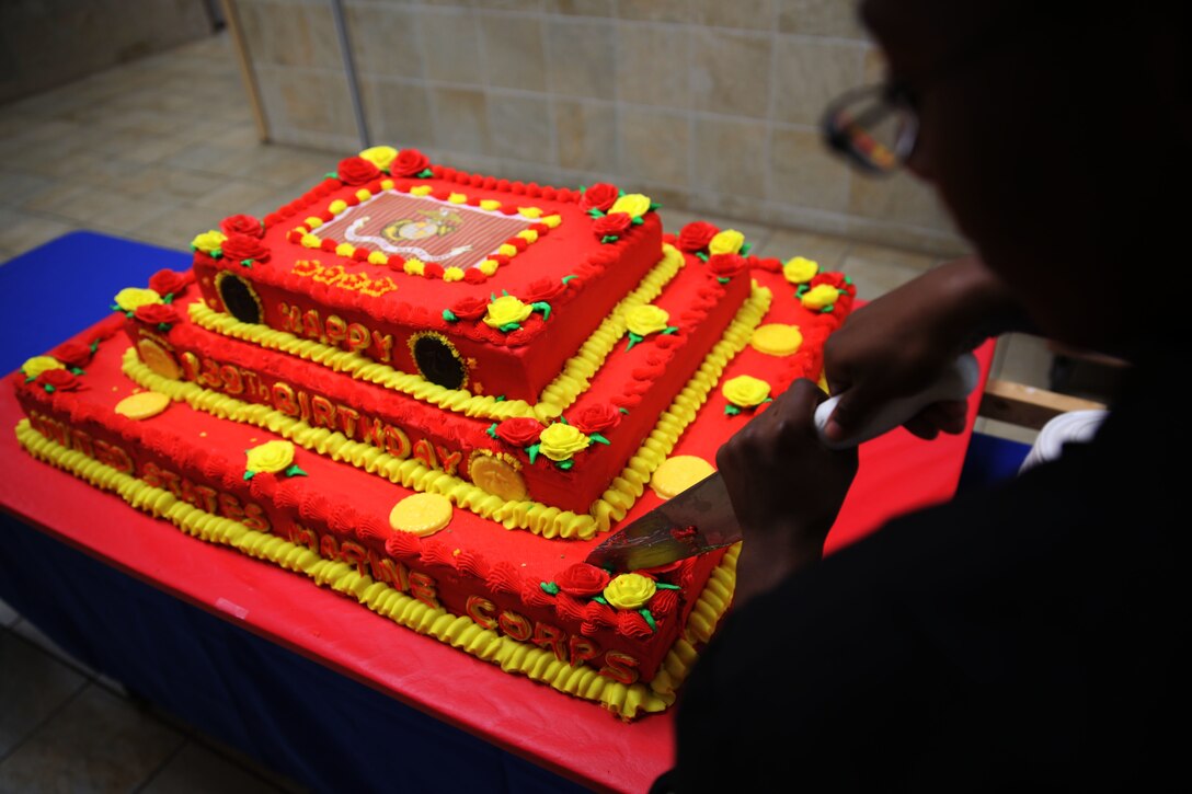 Cpl. DJeela A. Anderson makes the first cut into the Marine Corps’ 239th birthday cake at the mess hall at Marine Corps Air Station Cherry Point, N.C., Nov. 5, 2014. The official birthday of the Marine Corps is Nov. 10. Anderson is a food service specialist with Headquarters and Headquarters Squadron and native of Sicklerville, N.J.