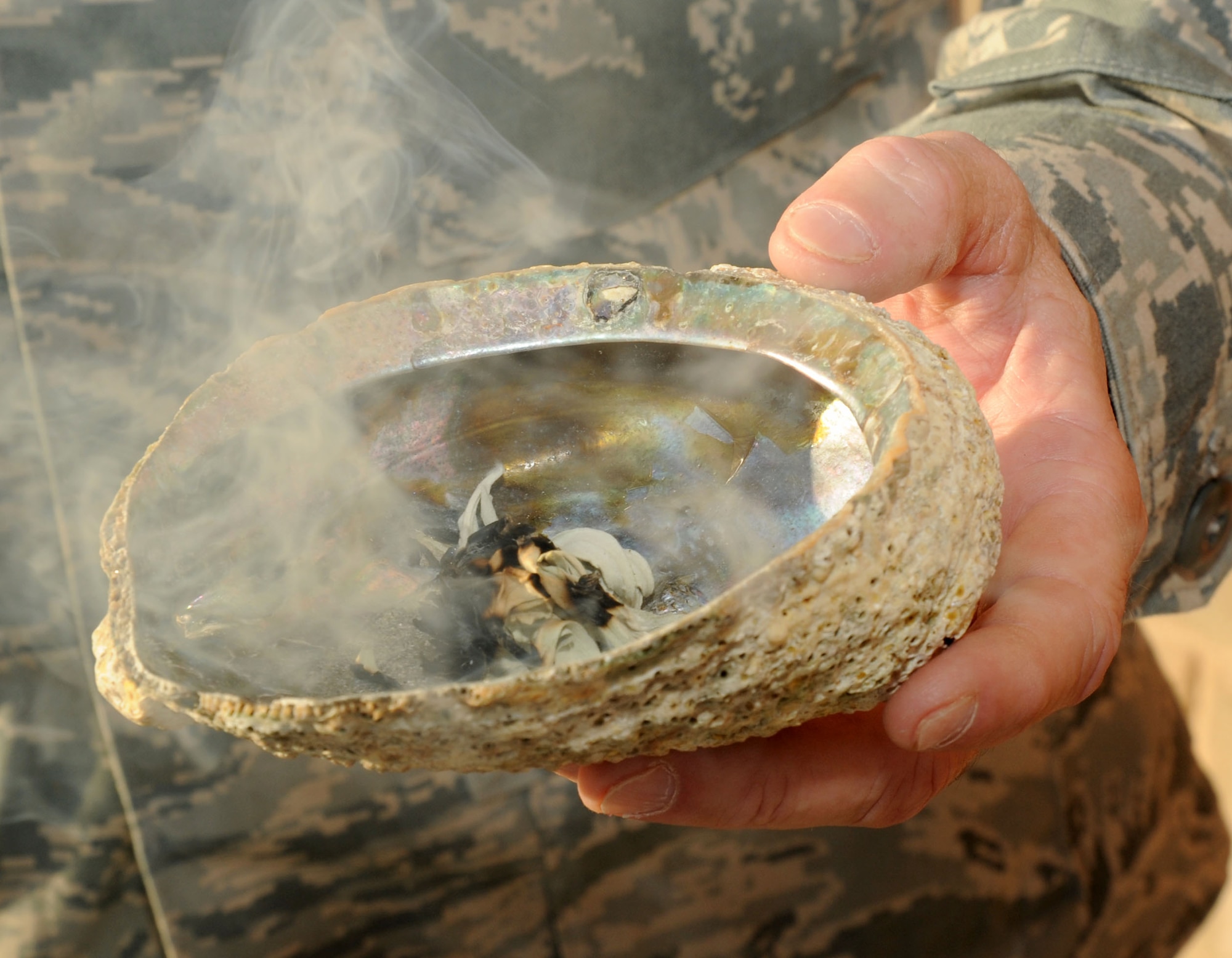 Sage smoke wafts from a ceremonial bowl during the 386th Air Expeditionary Wing’s Native American Heritage Month observance ceremony here Nov. 5, 2014. This year’s Native American Heritage Month theme is, “Native Pride and Spirit: Yesterday, Today and Forever,” and the observance promotes the value of Native American ancestry and traditions. (U.S. Air Force photo by Master Sgt. Eric Petosky/released)