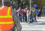 Sgt. Maurice Nichols, 275th Military Police Company, helps the Metropolitan Police Department control traffic in Washington, D.C., Nov. 11, 2014, when the 'Concert for Valor' attracted hundreds of thousands to the capital.  