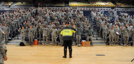 Lt. Robert Glover, Metropolitan Police Department Special Operations Division, swears in District of Columbia National Guard Soldiers as special police officers at the Armory in Washington, D.C., Nov. 11, 2014. The Soldiers assisted law enforcement officers for Veterans Day events.