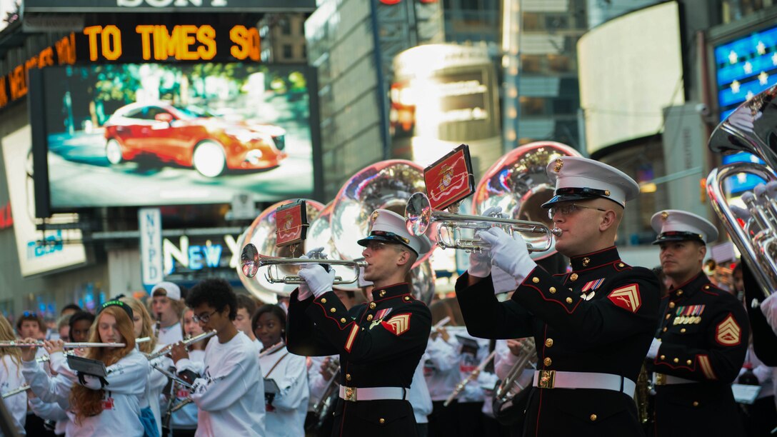 The Quantico Marine Corps Band, from Marine Corps Base Quantico, Virginia, performed at Times Square in New York City with more than 1,000 high school student for the Band of Pride Tribute Concert on November 10, 2014. The bands drew crowds of people who listened, rendered salutes, and took photos and video of the performance.