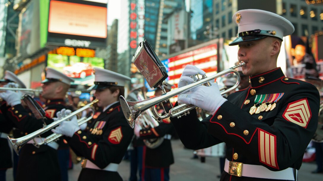 The Quantico Marine Corps Band, from Marine Corps Base Quantico, Virginia, performed at Times Square in New York City with more than 1,000 high school student for the Band of Pride Tribute Concert on November 10, 2014. The bands drew crowds of people who listened, rendered salutes, and took photos and video of the performance.