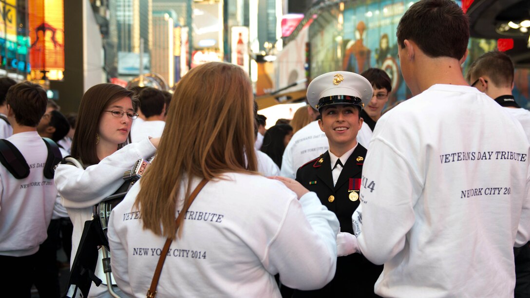 The Quantico Marine Corps Band, from Marine Corps Base Quantico, Virginia, performed at Times Square in New York City with more than 1,000 high school student for the Band of Pride Tribute Concert on November 10, 2014. The bands drew crowds of people who listened, rendered salutes, and took photos and video of the performance.