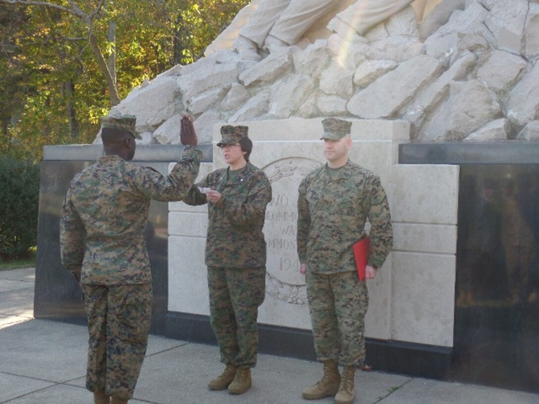 LtCol Elaine Henson administers the oath of enlistment to newly promoted GySgt Gerard Casimir of Training Command.