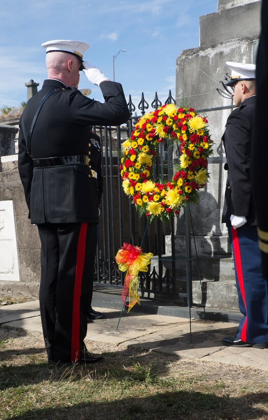 Lt. Gen. Richard P. Mills (left), commander of Marine Forces Reserve salutes the gravesite of Maj. Daniel Carmick in a wreath-laying ceremony at the St. Louis Cemetery #2 in New Orleans, Nov. 8, 2014. The ceremony honored Carmick, who fought in the War of 1812. Carmick distinguished himself by commanding Marines in the Battle of New Orleans, which helped repel British forces who sought to seize the city. 