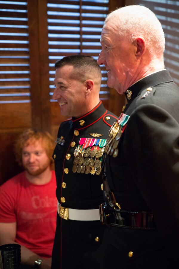 Lt. Gen. Richard P. Mills (right), commander of Marine Forces Reserve, and Sgt. Maj. Anthony A. Spadaro, sergeant major of MARFORRES, greet patrons at Luke Restaurant in New Orleans, Nov. 10, 2014. The restaurant owner, John Besh, served in the Marine Corps and holds an annual celebration to honor the Marine Corps birthday. 