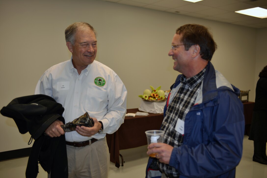 Director of the Tennessee Wildlife Resources Agency Ed Carter talks with Tim Higgs, chief of Environmental Section, Project Planning Branch, U.S. Army Corps of Engineers Nashville District during the  ceremony marking the completion of the new Cumberland River Aquatic Center at the Gallaatin Fossil Plant in Gallatin, Tenn.  
