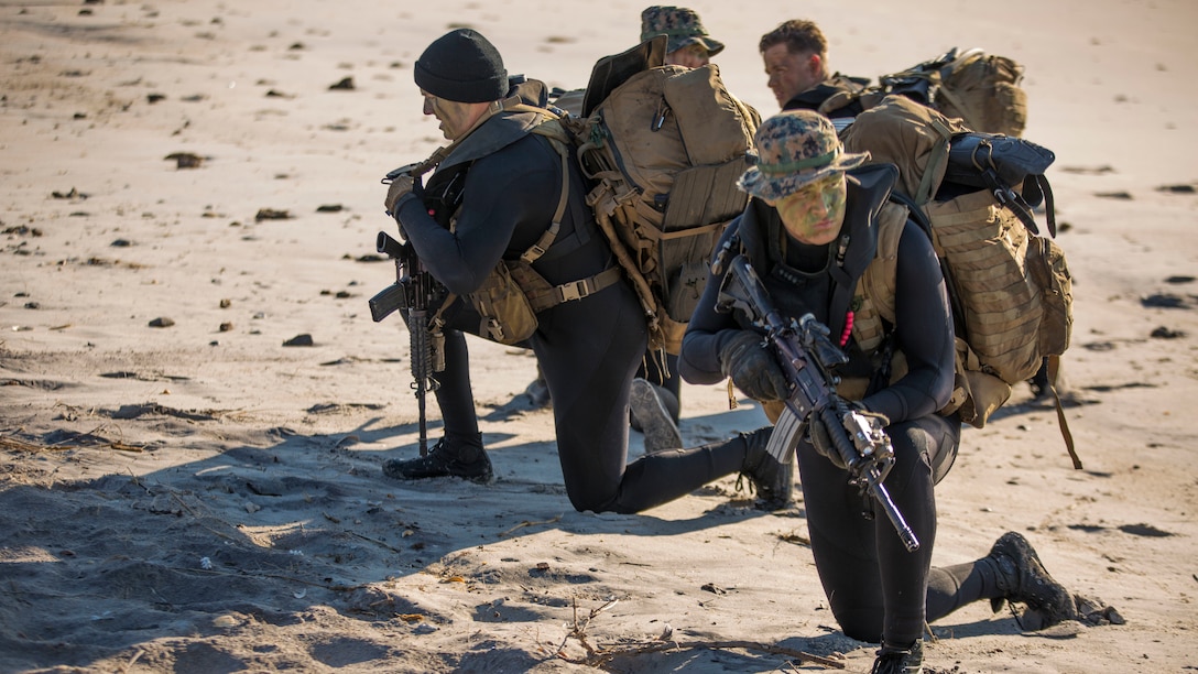 Marines with 2nd Reconnaissance Battalion, 2nd Marine Division provide security after landing at Onslow Beach, N.C., during beach operations training aboard Camp Lejeune, N.C., Nov. 4, 2014, as part of Exercise Bold Alligator 14. Bold Alligator 14 is a scenario-driven exercise designed to improve naval amphibious core competence, increase proficiency in operations ranging from foreign disaster relief to limited force entry, and help grow interoperability with coalition forces. (U.S. Marine Corps photo by Cpl. James R. Smith/Released)