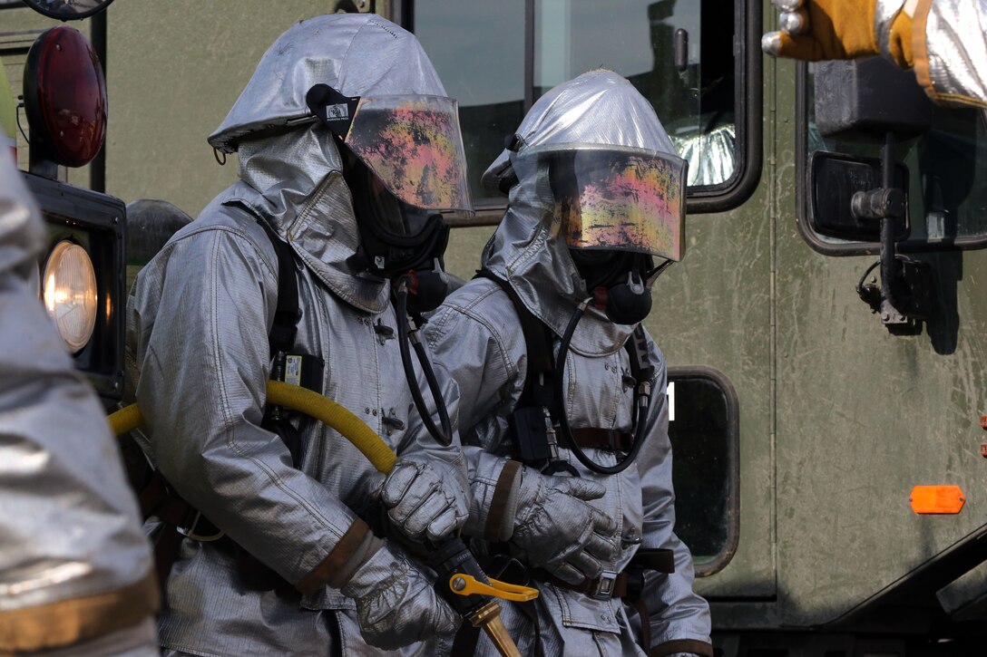 Marines gear-up to start the P-19 evaluations at Marine Corps Air Station Cherry Point N.C., Oct.28, 2014. Aircraft rescue firefighters were chosen from around the Corps to participate in the evaluations. 