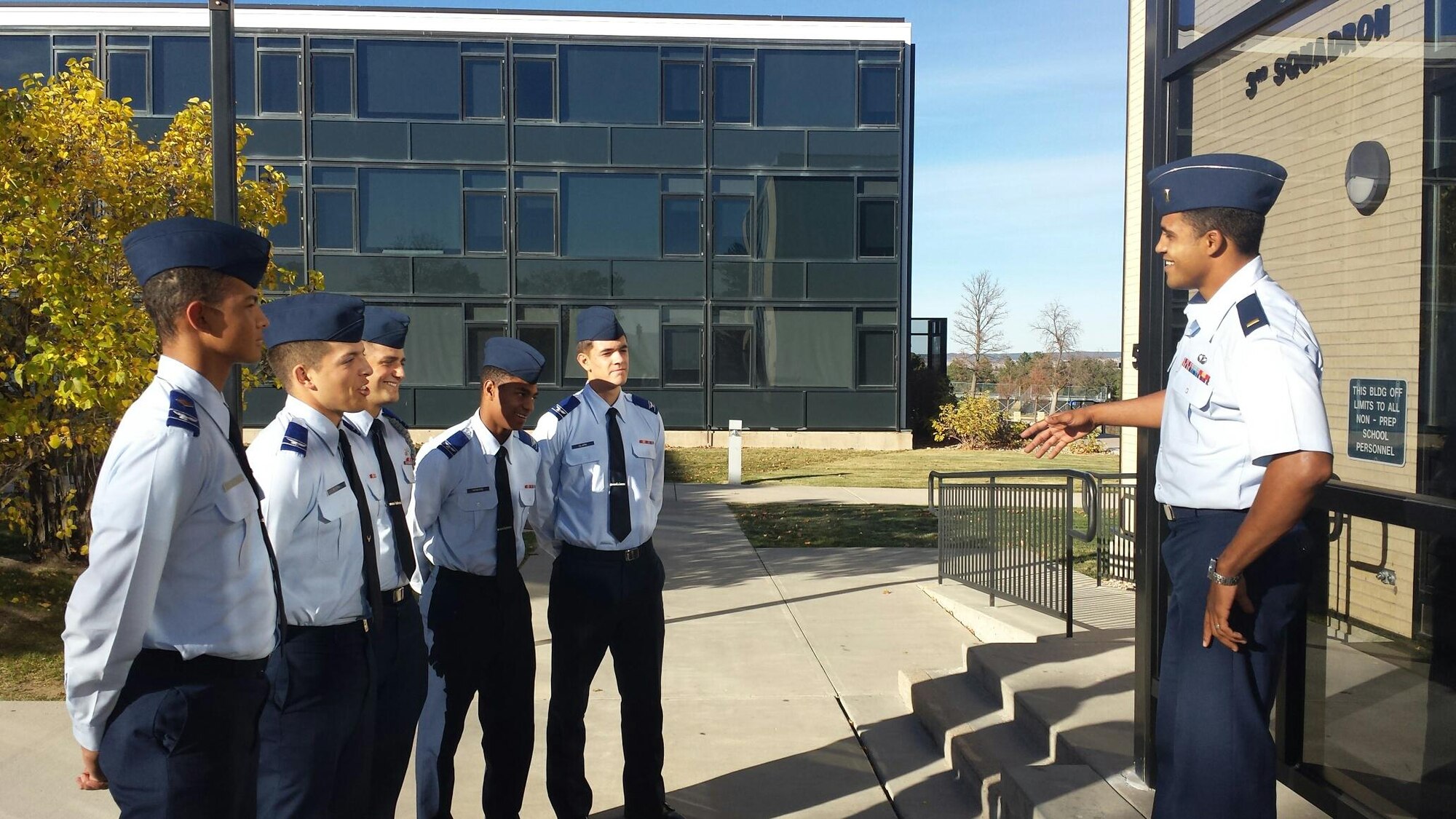 Second Lt. Devin Hightower chats with Cadet Candidates Isaiah Honable (left), Jordan Rivera, Zachary Lamarca, Tyrell Howard and Dylan Clark on the importance of maintaining military standards Nov. 5, 2014, in Colorado Springs, Colo. Hightower is a U.S. Air Force Academy Preparatory School military training officer. (U.S. Air Force photo)