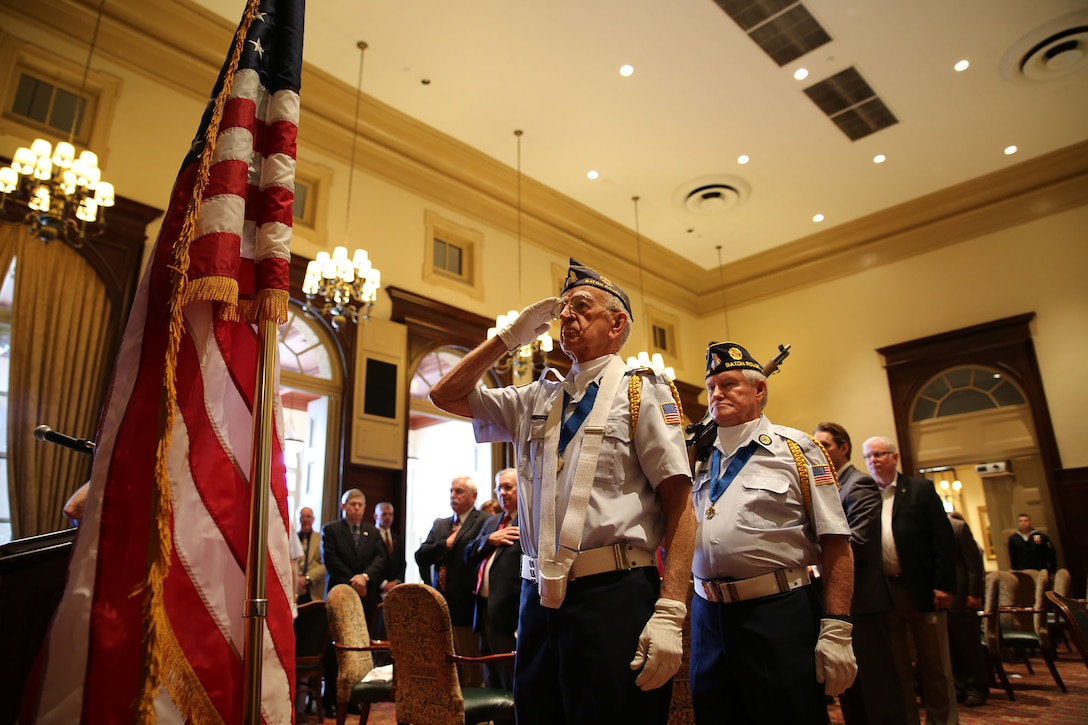 Members of the American Legion Honor Guard present the colors during the Veterans Day program held at the City Club of Baton Rouge in downtown Baton Rouge, La., Nov. 11, 2014. The Commander of Marine Forces Reserve, Lt. Gen. Richard P. Mills, was the guest speaker and expressed appreciation for the generous support of local veterans.