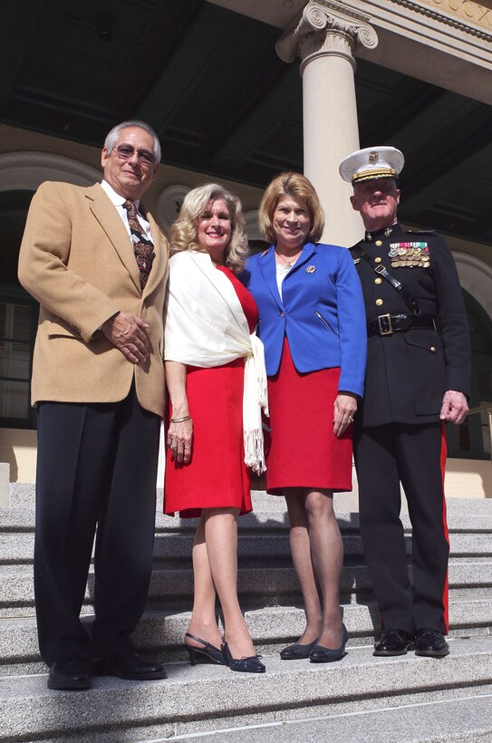 Lt. Gen. Richard P. Mills, (far right), commander of Marine Forces Reserve, stands with his wife, Patricia, and Gil and Donna Lerma, members of the City Club of Baton Rouge, following a Veterans Day program held at the club in downtown Baton Rouge, La., Nov. 11, 2014.  Local veterans attended the event as Mills thanked them for their service and expressed gratitude to the local community for their continued support of the armed forces.  