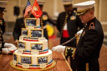 Col. S. E. Redifer, commanding officer of the Chemical Biological Incident Response Force, II Marine Expeditionary Force, cuts the birthday cake at the 239th Marine Corps ball on Saturday, November 8, 2014. It is customary at Marine Corps birthday celebrations worldwide to cut a traditional cake in celebration of the birth of our illustrious Corps. 
