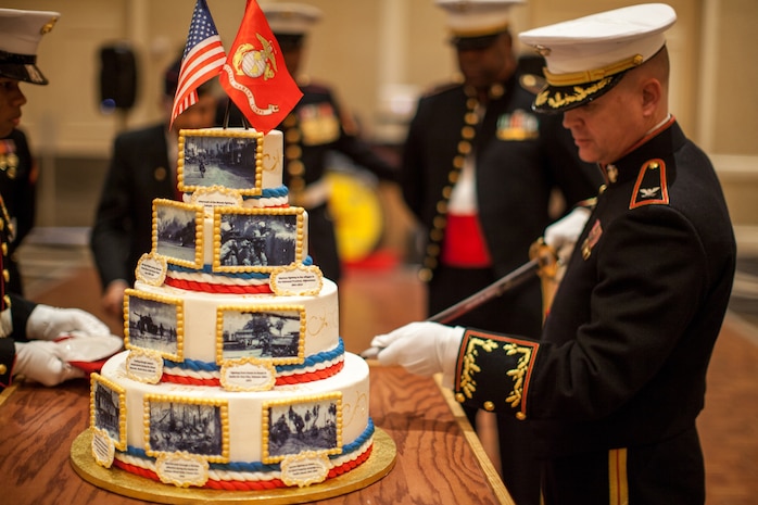 Col. S. E. Redifer, commanding officer of the Chemical Biological Incident Response Force, II Marine Expeditionary Force, cuts the birthday cake at the 239th Marine Corps ball on Saturday, November 8, 2014. It is customary at Marine Corps birthday celebrations worldwide to cut a traditional cake in celebration of the birth of our illustrious Corps. 