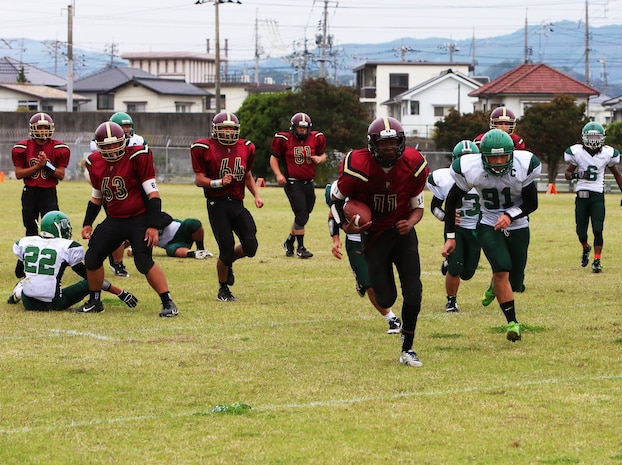 Jarell Davis, a Matthew C. Perry Samurai running back, breaks away from the Daegu Warrior defense to score a touchdown during the 2014 Department of Defense Dependents Schools Far East Division II Football Championship Game at the Matthew C. Perry High School football field aboard Marine Corps Air Station Iwakuni, Japan, Nov. 8, 2014. Harris ran for 285 yards and scored three touchdowns in a losing effort. The Warrior won the title game 60-50.