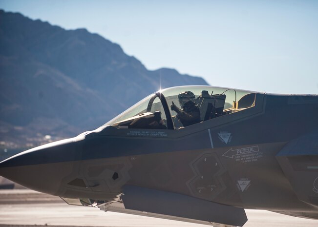 Maj. Brad Matherne, 59th Test and Evaluation Squadron F-35 test director, gives a thumbs-up during the Nellis Open House at Nellis Air Force Base, Nev., Nov. 8, 2014. Matherne piloted an F-35A Lightning II during the open house, which also marked the first public display of the aircraft at Nellis AFB. (U.S. Air Force photo by Staff Sgt. Siuta B. Ika)