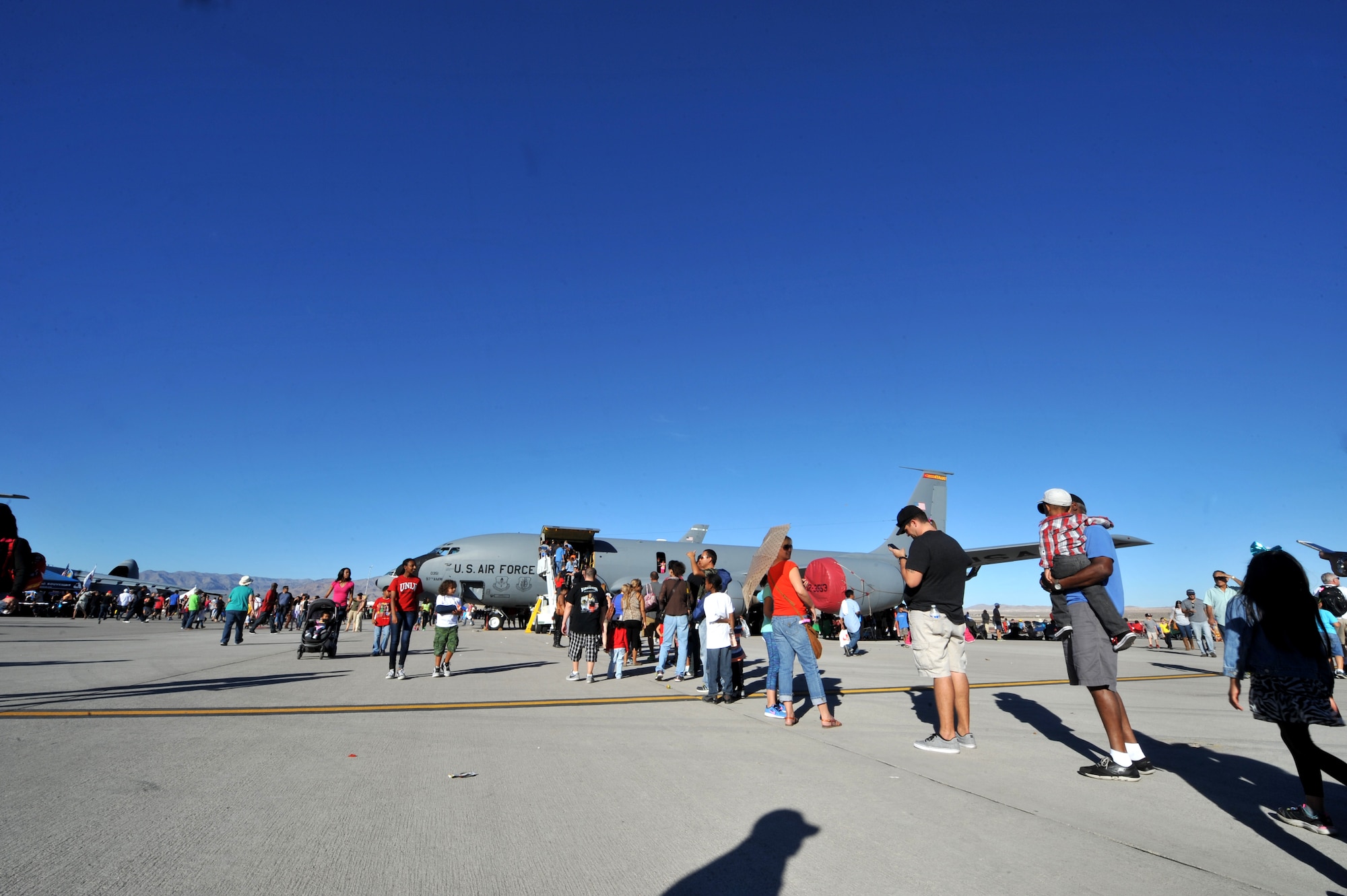 Visitors to the Nellis Open House stand in line to tour the KC-135 Stratotanker at Nellis Air Force Base, Nev., Nov. 9, 2014. The KC-135 Stratotanker provides the core aerial refueling capability for the U.S. Air Force and excelled in this role for more than 50 years. (U.S. Air Force photo by Tech. Sgt. Sanjay Allen)