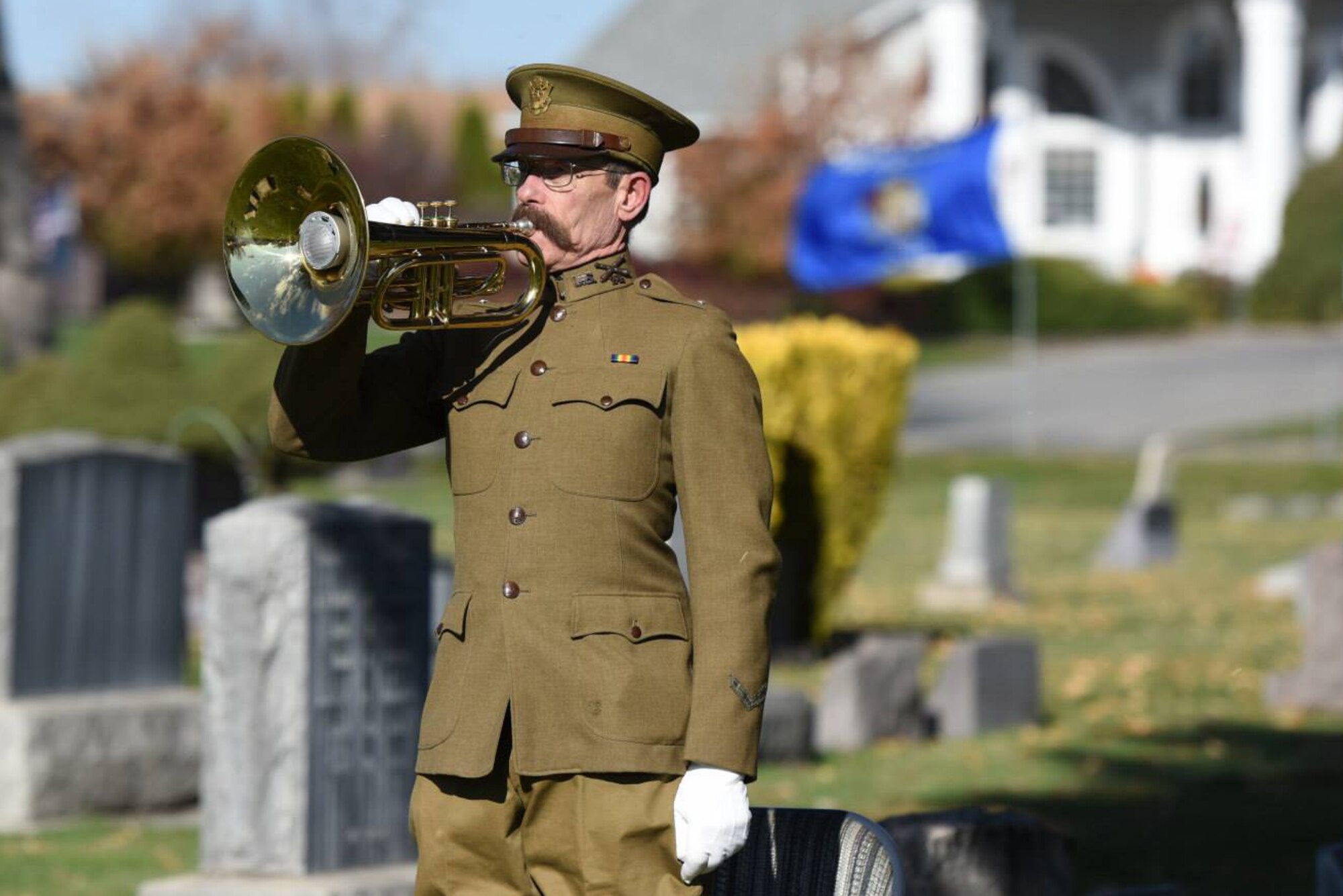Jimmy Gould plays the bugle at the city cemetery on Veterans Day Nov. 11, 2014. The ceremony recognized all veterans’ service and was located in Mountain Home, Idaho. (U.S. Air Force photo by Tech. Sgt. JT May III/RELEASED)