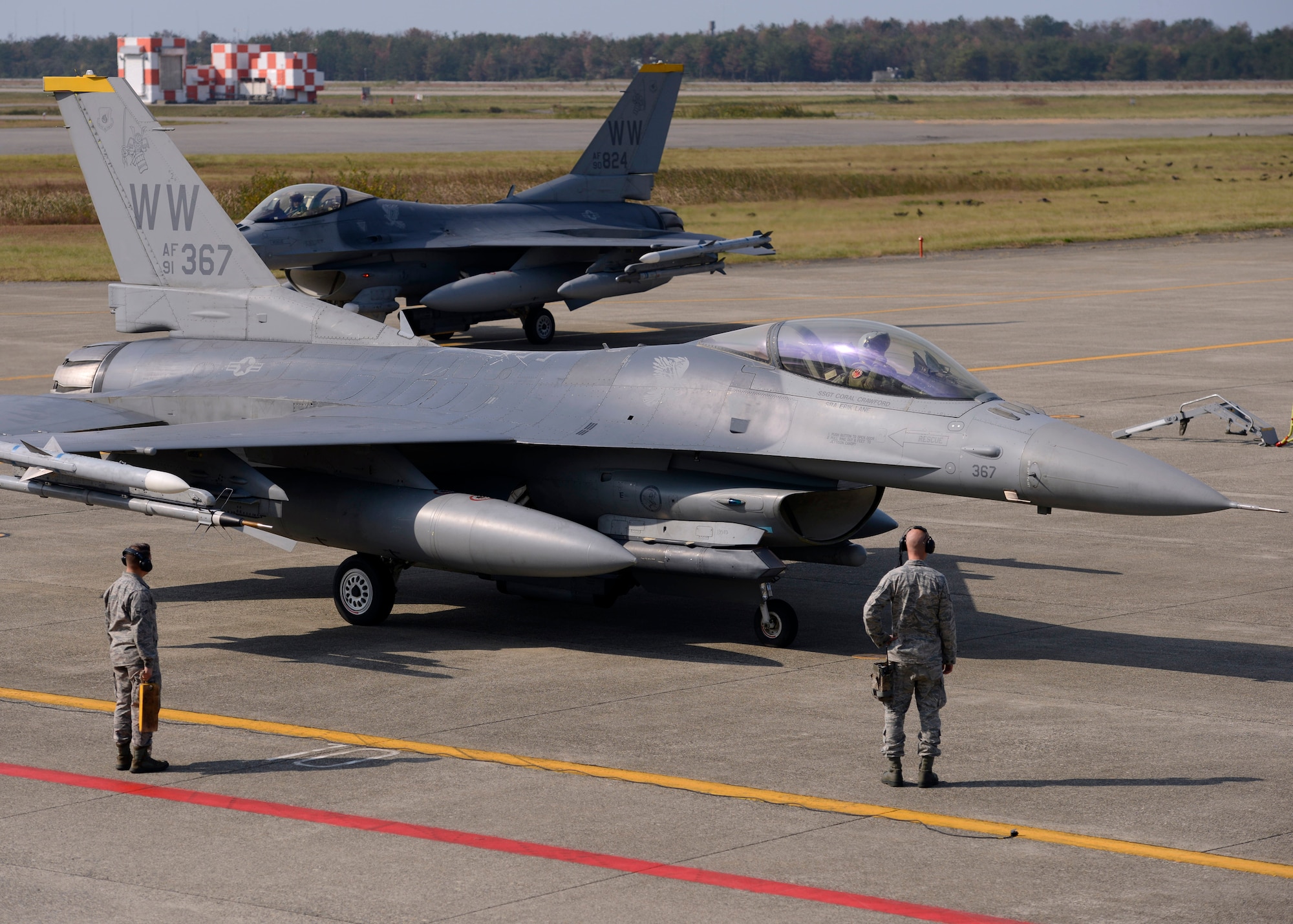 Maintainers from the 14th Aircraft Maintenance Unit greet pilots from the 14th Fighter Squadron upon their arrival to Komatsu Air Base, Japan, from Misawa Air Base, Japan, Nov. 7, 2014. Pilots and maintainers from the 35th Fighter Wing are at Komatsu AB as part of the Aviation Training Relocation program, which allows U.S. and Japanese forces to further enhance their interoperability and joint partnership by conducting training away from the U.S. forces' home station. This simultaneously provides a noise respite for those living near the U.S. Air Force installations of the units participating in ATRs throughout Japan. (U.S. Air Force photo by Staff Sgt. Alyssa C. Wallace)