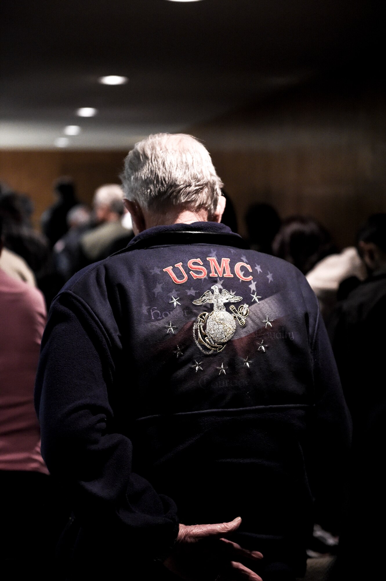 A U.S. Marine Corps veteran listens to the Fort Logan National Cemetery’s Veterans Day remembrance service closing remarks Nov. 11, 2014, in Englewood, Colo. The observance, originally planned to be held at Fort Logan, was moved to VFW Post 9644 due to inclement weather and included several guest speakers, patriotic music and a wreath-laying ceremony in honor of fallen service members. (U.S. Air Force photo by 1st Lt. Trevor Zakrzewski/Released)