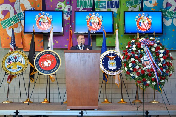 Col. Brian McDaniel, the 92nd Air Refueling Wing commander, speaks to the Spokane community during a Veterans Day ceremony  Nov. 11, 2014, at the Spokane Veterans Memorial Arena in Spokane, Wash. The purpose of Veterans Day is to honor America's veterans for their patriotism, love of country, willingness to serve and sacrifice for the common good. Fairchild Airmen visited several locations Nov. 11 to show appreciation and interact with veterans. (U.S. Air Force photo/Airman 1st Class Janelle Patiño)