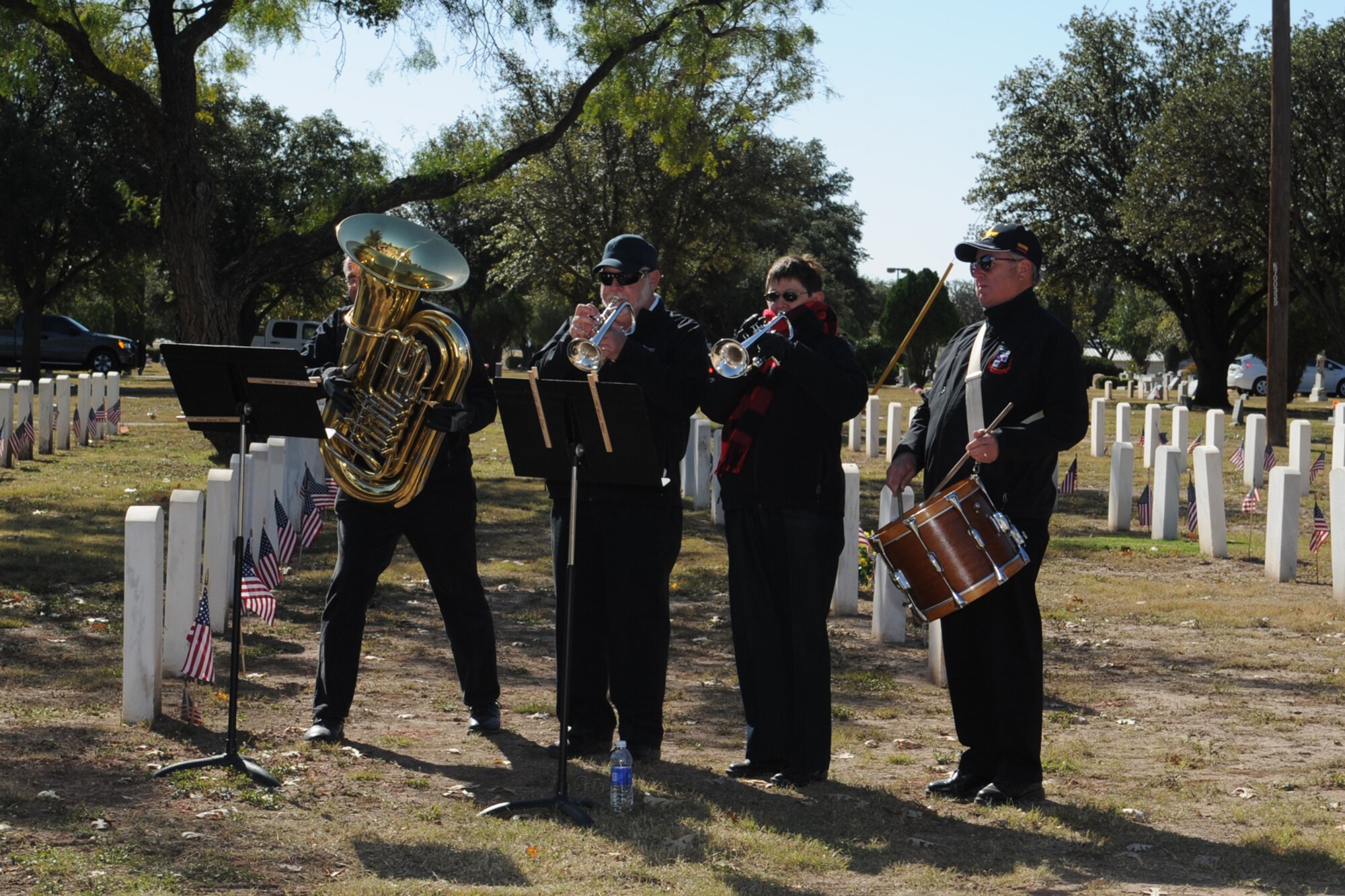 SAN ANGELO, Texas -- The Icehouse Brass Band performs the national anthem during a Veterans Day ceremony at Fairmount Cemetery Nov. 11. The ceremony honored veterans and acknowledged their sacrifices in service to our country. (U.S. Air Force photo/ Staff Sgt. Laura R. McFarlane)