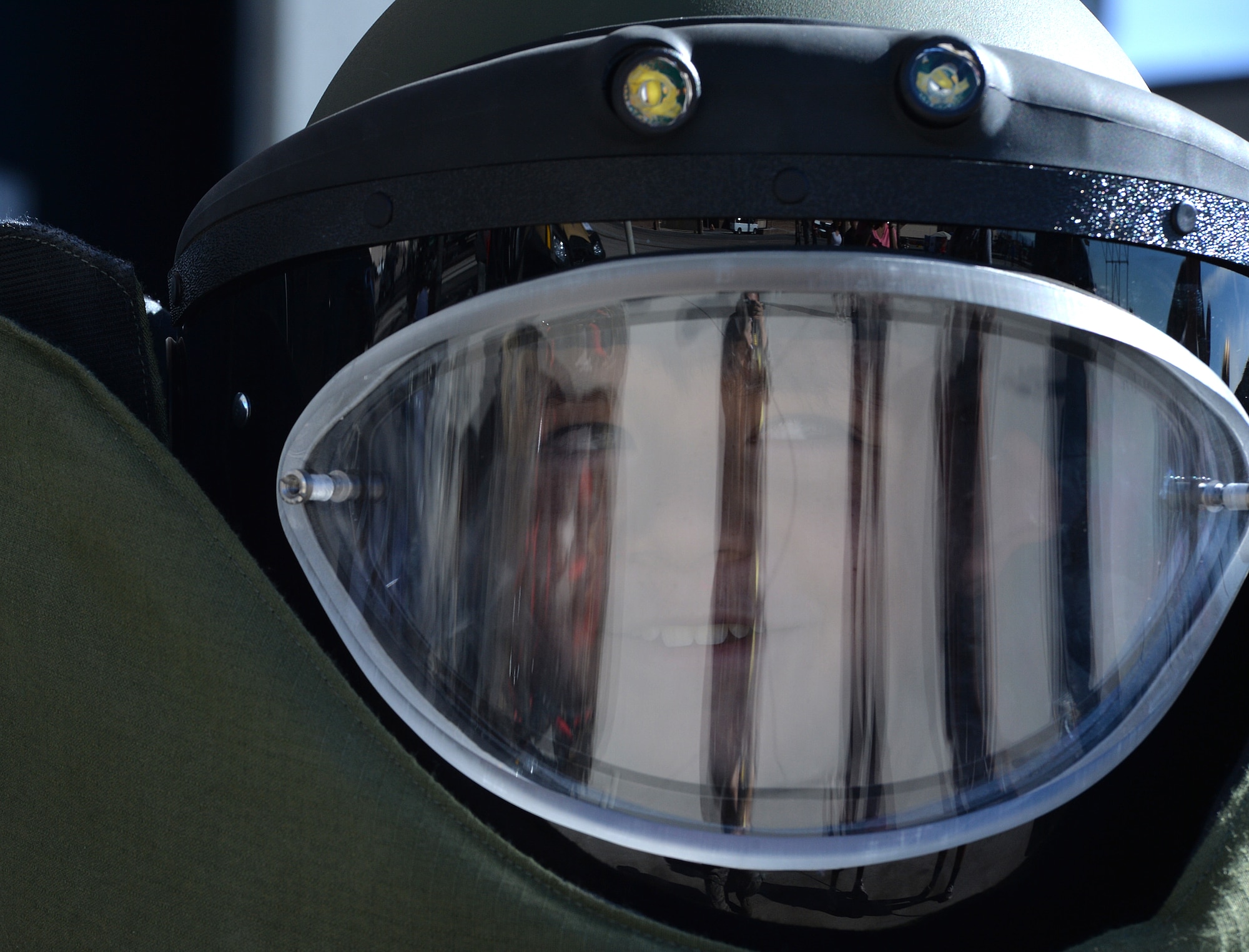 Mitchell Johnson, 11, dresses in a explosive ordnance disposal suit during the Nellis Air Force Base 2014 Open House on Nellis AFB, Nevada, Nov. 9, 2014. The two-day event includes aerial demonstration from a variety of legacy bomber aircraft, a Korean Conflict reenactment, and a United States Air Force Aerial Demonstration Team Thunderbirds performance. (U.S. Air Force photo by Tech. Sgt. Nadine Barclay)