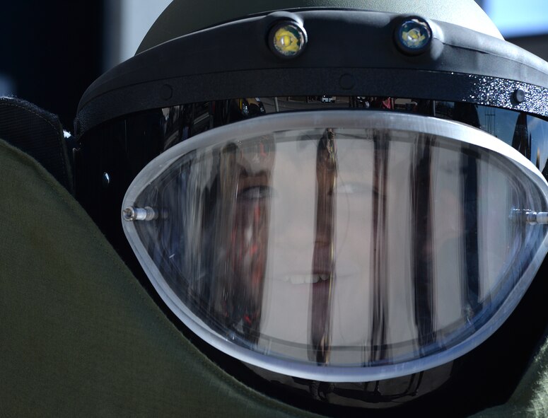 Mitchell Johnson, 11, dresses in a explosive ordnance disposal suit during the Nellis Air Force Base 2014 Open House on Nellis AFB, Nevada, Nov. 9, 2014. The two-day event includes aerial demonstration from a variety of legacy bomber aircraft, a Korean Conflict reenactment, and a United States Air Force Aerial Demonstration Team Thunderbirds performance. (U.S. Air Force photo by Tech. Sgt. Nadine Barclay)