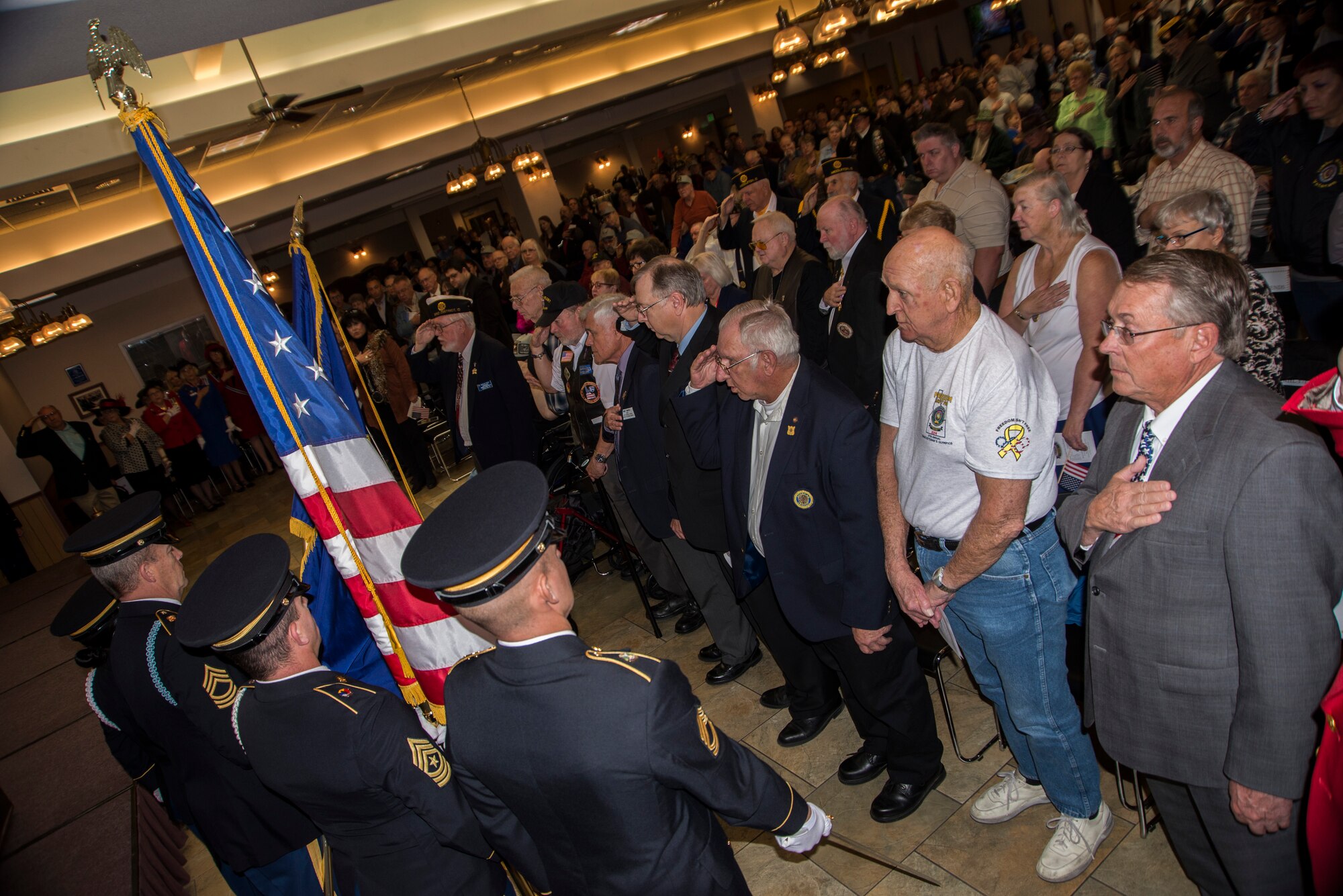 Members of the Gowen Field Honor Guard post the colors during a Veterans Day ceremony held at the Idaho State Veterans Home in Boise, Idaho, Nov. 11, 2014. Veterans Day is a day to reflect on the contributions that past and present veterans have made in their service to the United States. (U.S. Air Force photo by Staff Sgt. Roy Lynch/RELEASED)