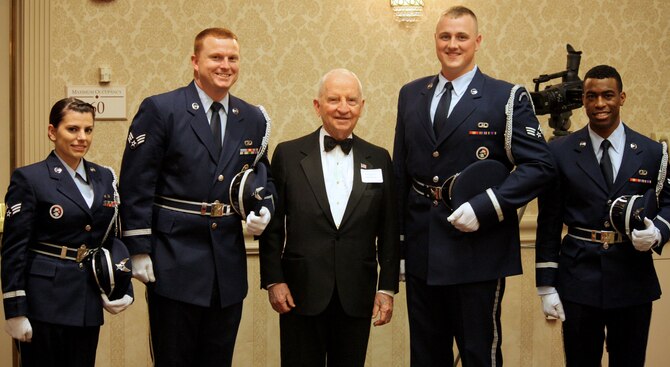 Senior Airman Christina Sullivan, Senior Airman Ray Greene, Senior Airman Calvin Erkens and Airman 1st Class Chelan Carr pose with former presidential candidate Ross Perot Nov. 8 at the Oklahoma Tower Hotel in Oklahoma City. The Silver Talon Honor Guard members performed a prisoner-of-war and missing-in-action table ceremony at the Oklahoma Military Hall of Fame announced its 2014 class of inductees. (Courtesy photo)