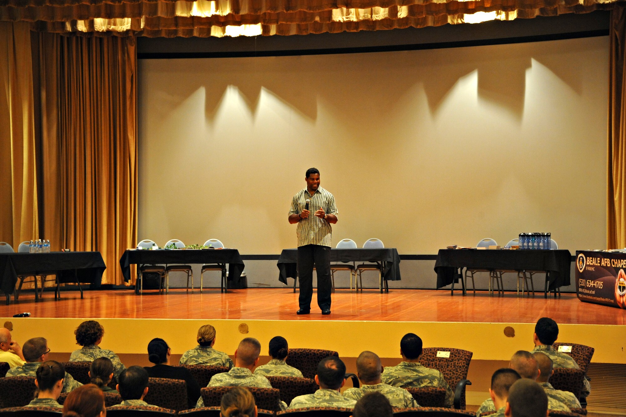 Herschel Walker, former National Football League running back and Patriots Support Program Anti-Stigma Campaign spokesman, speaks to Team Beale about mental health awareness Nov. 6, 2014, at Beale Air Force Base, Calif. Walker was diagnosed with dissociative identity disorder approximately 15 years ago, which is a form of multiple personalities. (U.S. Air Force photo by Airman 1st Class Ramon A. Adelan/Released)